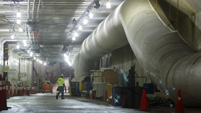 Crews place the final piece of the Midtown Tunnel into place in the Elizabeth river in Norfolk. Photo by Daily Press 